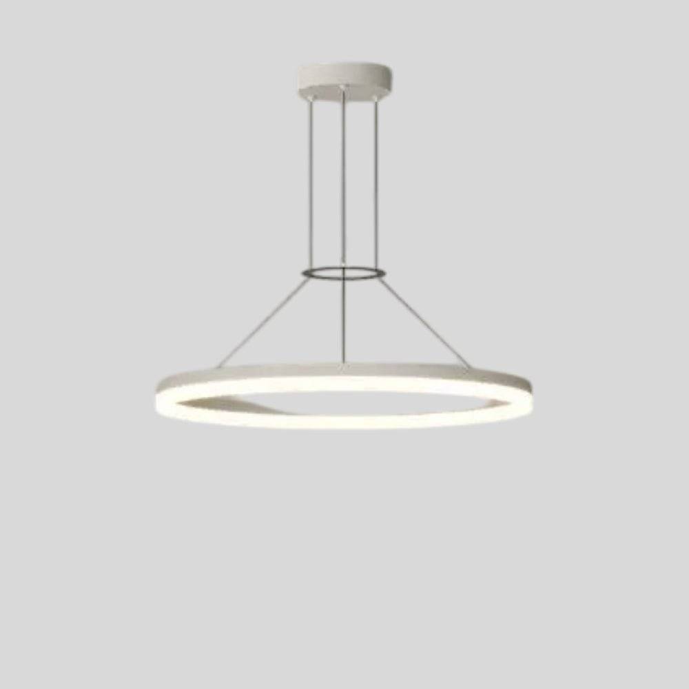 "A modern white ring chandelier with a lit ring against a grey background."